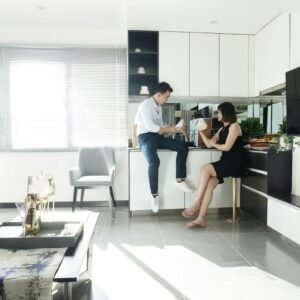 woman in blue shirt sitting on chair